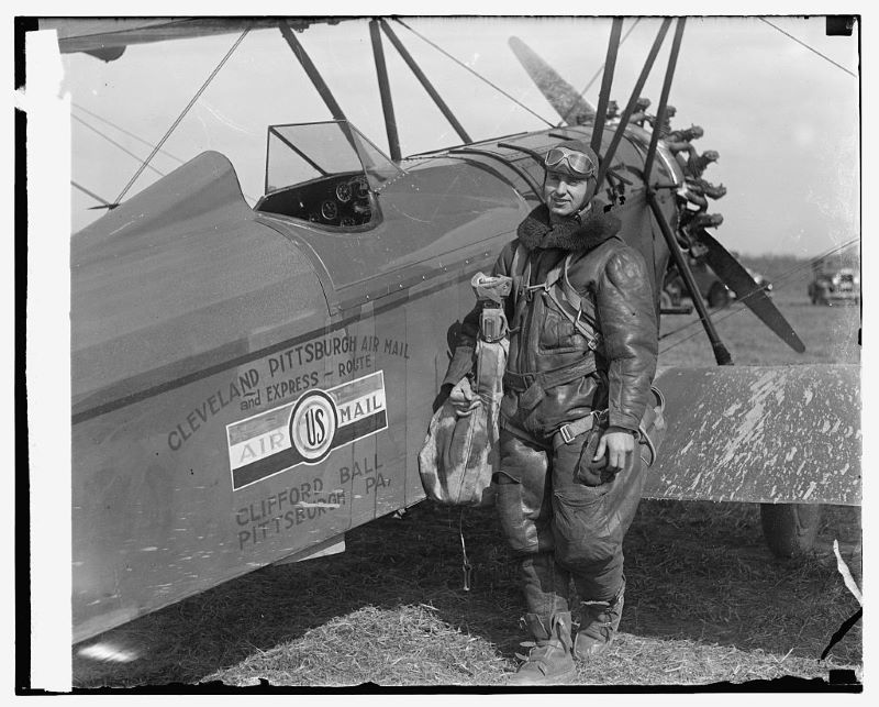 Photo of an air mail pilot and airplane.