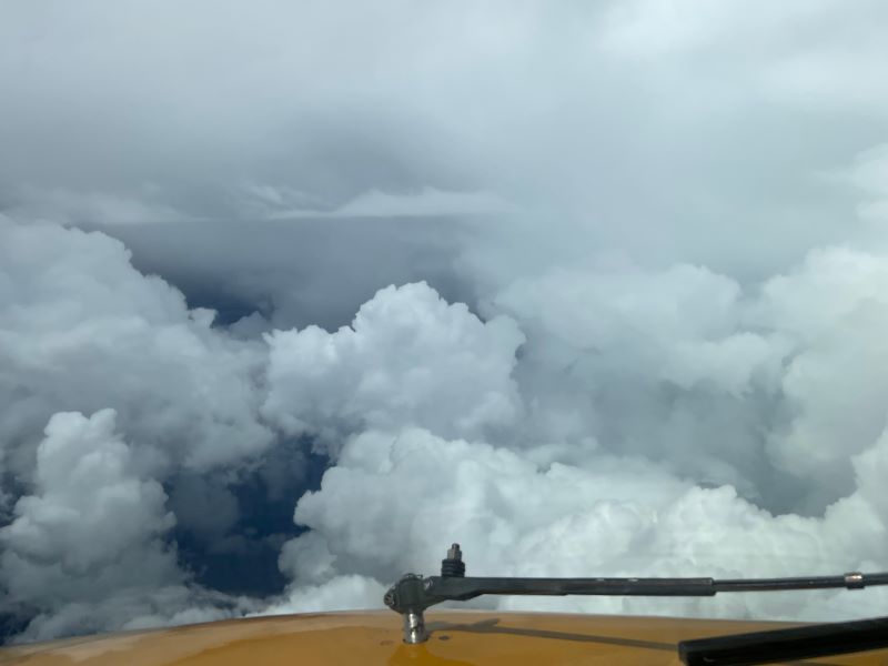 Airplane flying through the clouds.